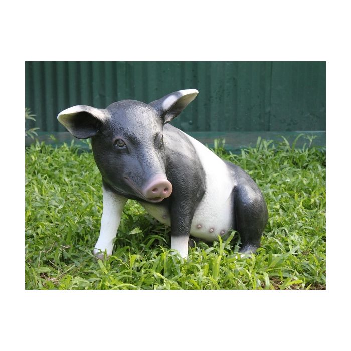 Schwarzweißes Schwein sitzend lebensgroß Dekorationsfigur