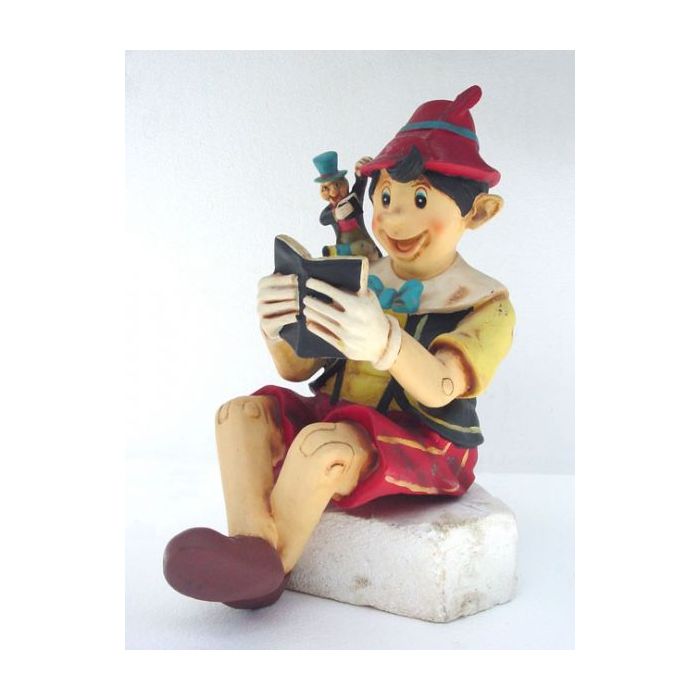 Pinocchio lesend lebensgroß Dekorationsfigur