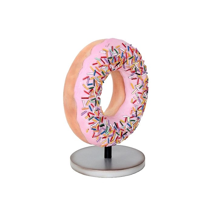 Donut rosa auf kleinem Ständer vergrößert Dekorationsfigur