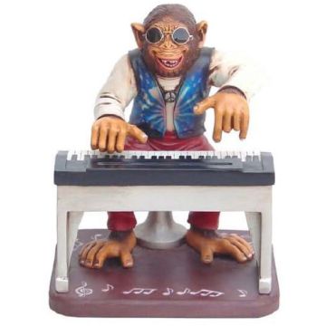 Affe am Keyboard lebensgroß