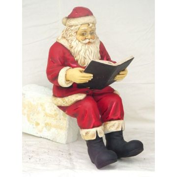 Weihnachtsmann Buch lesend lebensgroß