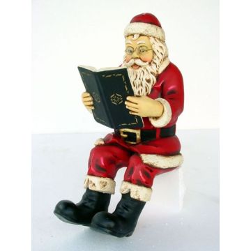 Weihnachtsmann Buch lesend klein verkleinert
