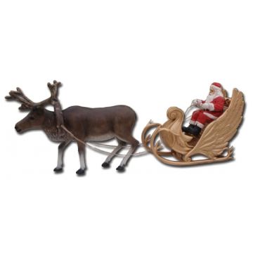 Weihnachtsschlitten zusammen mit Rentier lebensgroß