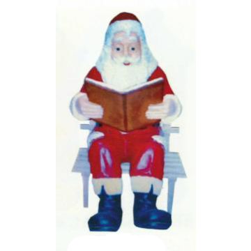 Weihnachtsmann sitzend auf Bank mit Buch verkleinert